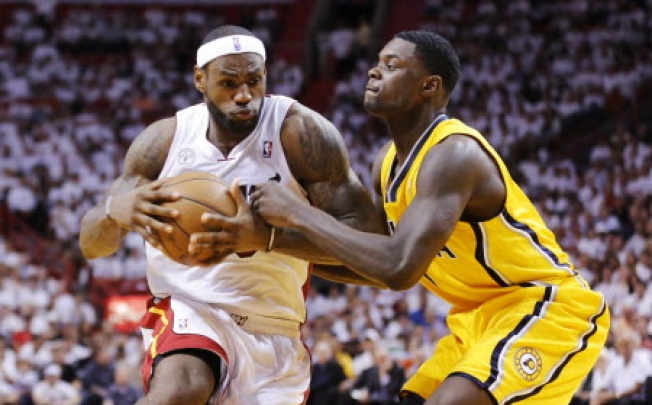 Miami Heat's James drives on Indiana Pacers' Stephenson during their NBA Eastern Conference final basketball playoff in Miami. Photo: Reuters