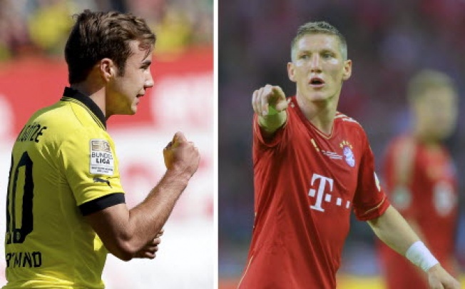 Borussia Dortmund's Mario Goetze (left) and Bayern Munich's Bastian Schweinsteiger. Photo: EPA