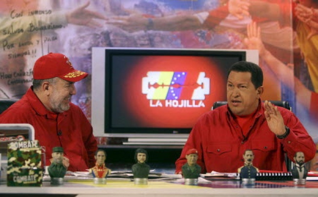 Then Venezuelan president Hugo Chavez appearing on television with anchor Mario Silva in Caracas in 2007. Photo: AP