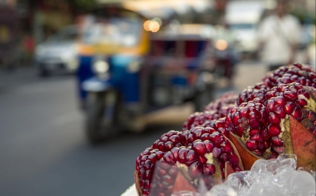 Pomegranates for sale at a street food stall in Bangkok's Chinatown. Photos: Gavin Gough
