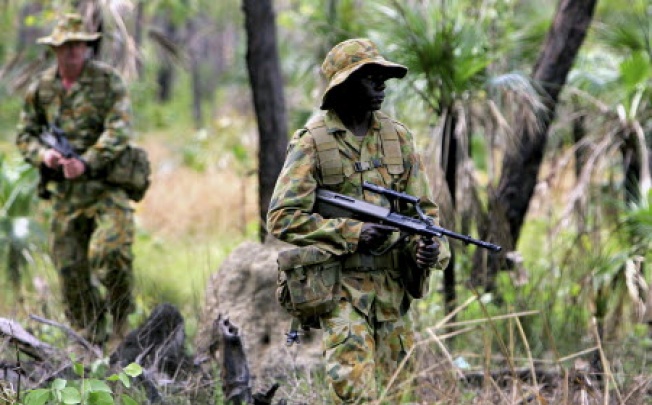 Australian troops on a training  exercise. Australia is warned military personnel to be vigilant about copy-cat attacks after the murder of a soldier in London. Photo: Reuters