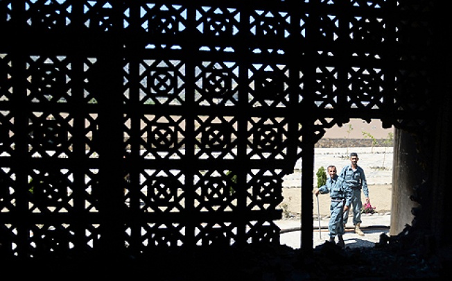 Afghan defence personnel inspect the scene following a suicide attack in Bazarak district, Panjshir province, on Wednesday. Photo: AFP