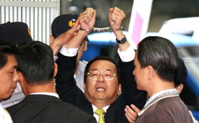 Taiwan's ex-president Chen Shui-bian shouting 'Political Persecution' following sentencing at Taipei District Court in Taipei, Taiwan. Photo: EPA