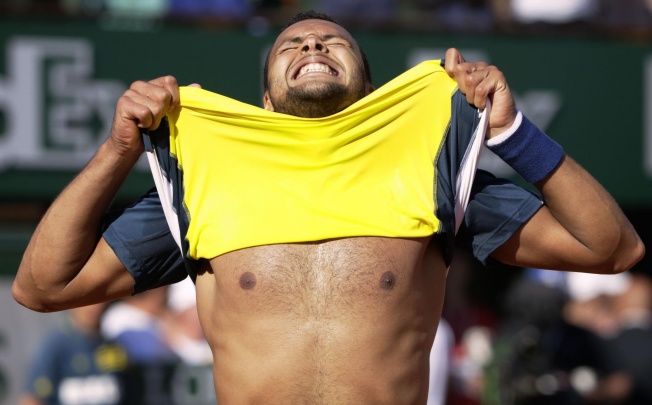 Jo-Wilfried Tsonga celebrates his victory over Roger Federer at the end of their French Open quarter-final. Tsonga now plays David Ferrer for a place in the final. Photo: AFP