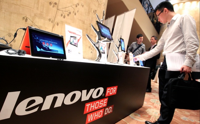 Lenovo tablets and mobile phones are displayed during a news conference. Photo: SCMP Pictures