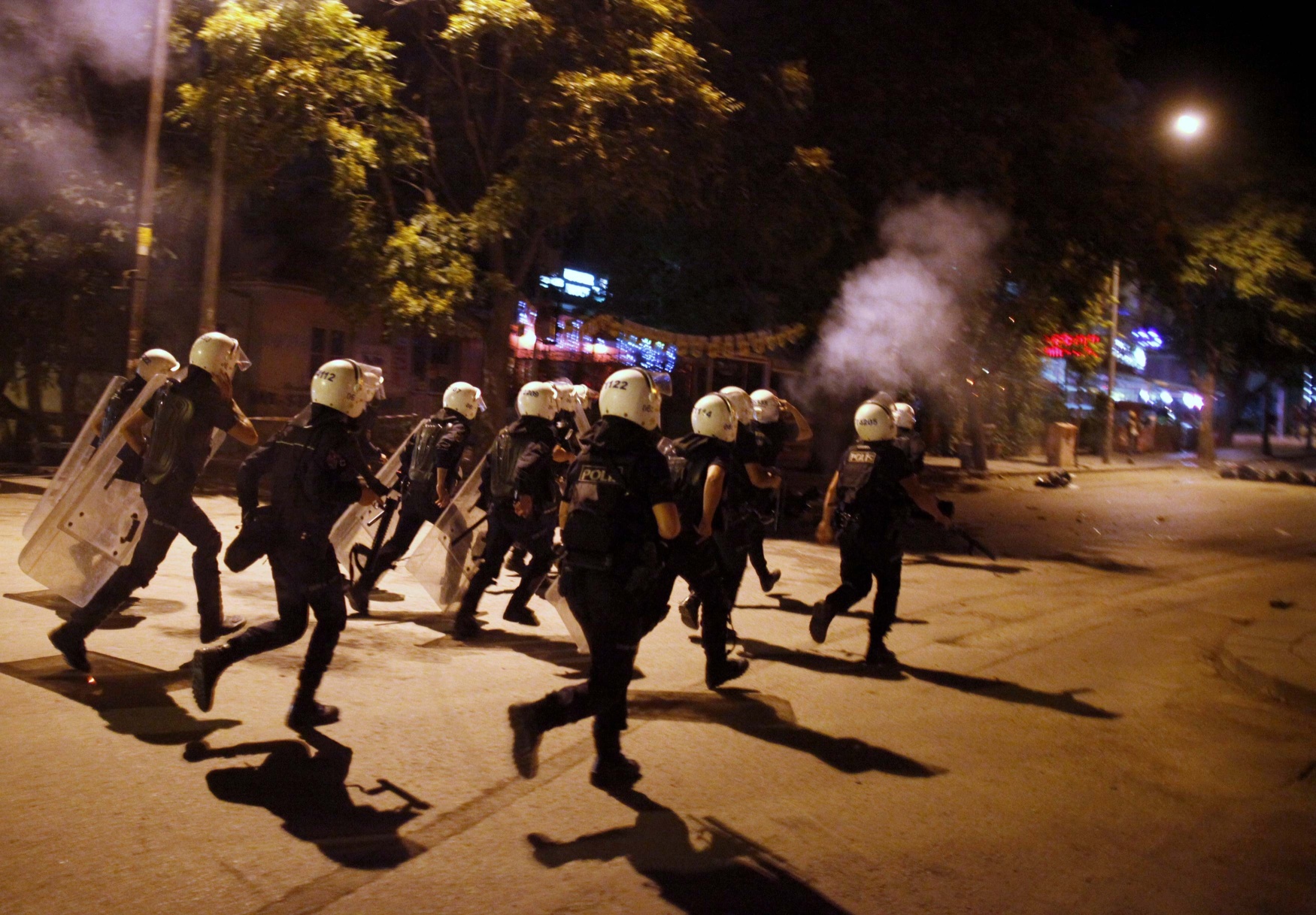 Turkish riot police chase anti-government protesters on Tuesday. Photo: Reuters
