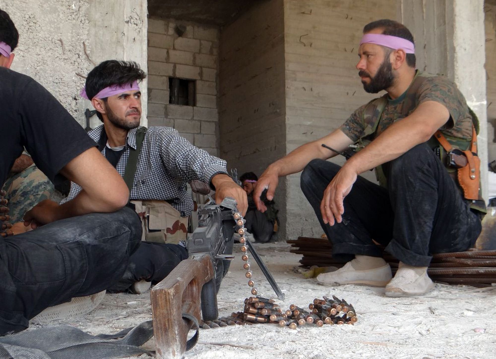 Syria rebels fighters sitting together in a building close to the northern city of Aleppo. Syria’s army launched multiple attacks on rebels on Tuesday in Aleppo. Photo: AFP