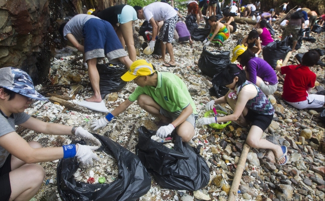 Over 150 volunteers from the Hong Kong based NGO, Ecovision moved 217 full bags of plastic, plastic pellets and assorted marine trash off Big Wave Bay beach last year. Photo: EPA