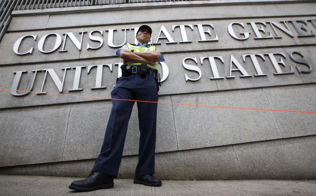 A police officer stands guard outside the US Consulate General in Hong Kong. Photo: AP