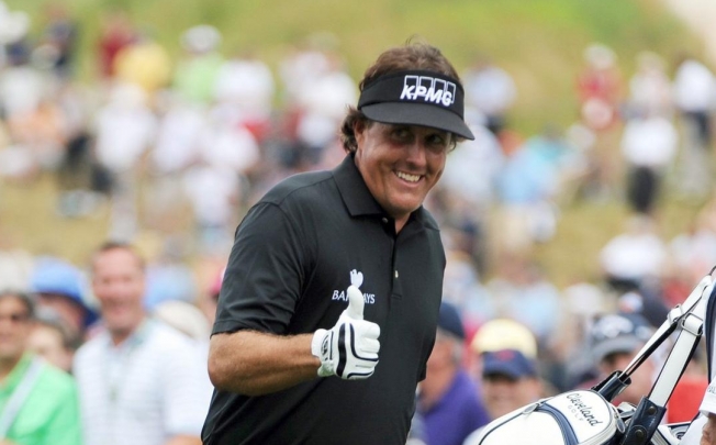 Mickelson smiles after sinking a putt at Merion. Photo: MCT
