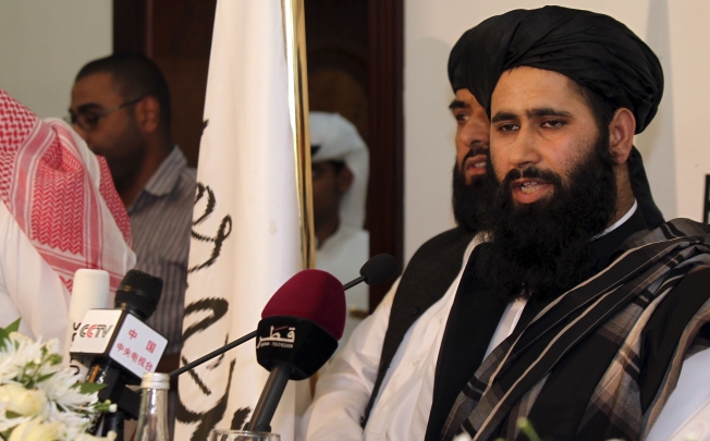 Muhammad Naeem, a representative of the Taliban, at the official opening of their office in Doha, Qatar. Photo: AP