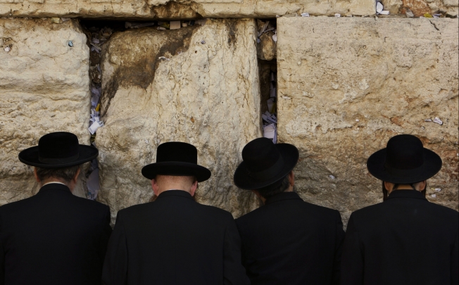 Jewish men pray at the Western Wall. Photo: Reuters