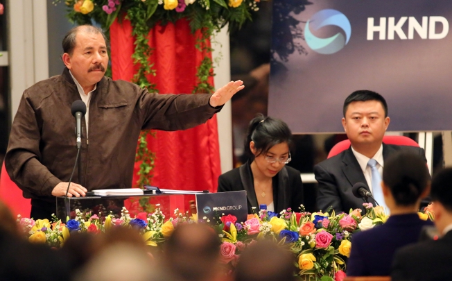 Nicaraguan President Daniel Ortega (left) speaks, while Wang Jing (right), boss of HKND Group looks on. HKND has won a concession to design, build and manage a US$40 billion canal in Nicaragua to rival Panama. Photo: AFP