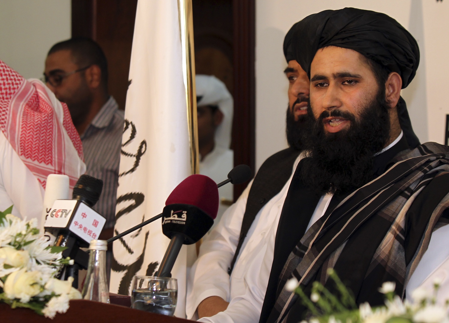 Muhammad Naeem a representative of the Taliban speaks at the official opening of their office in Doha, Qatar, Taliban fighters on Friday hailed the rebels’ new office in Qatar as evidence of their success on the front lines. Photo: AP