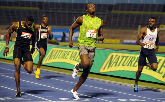 Jamaica's Usain Bolt  wins the qualification heat in the men's 100m dash of the Jamaica Senior National Trials in Kingston. Photo: AP