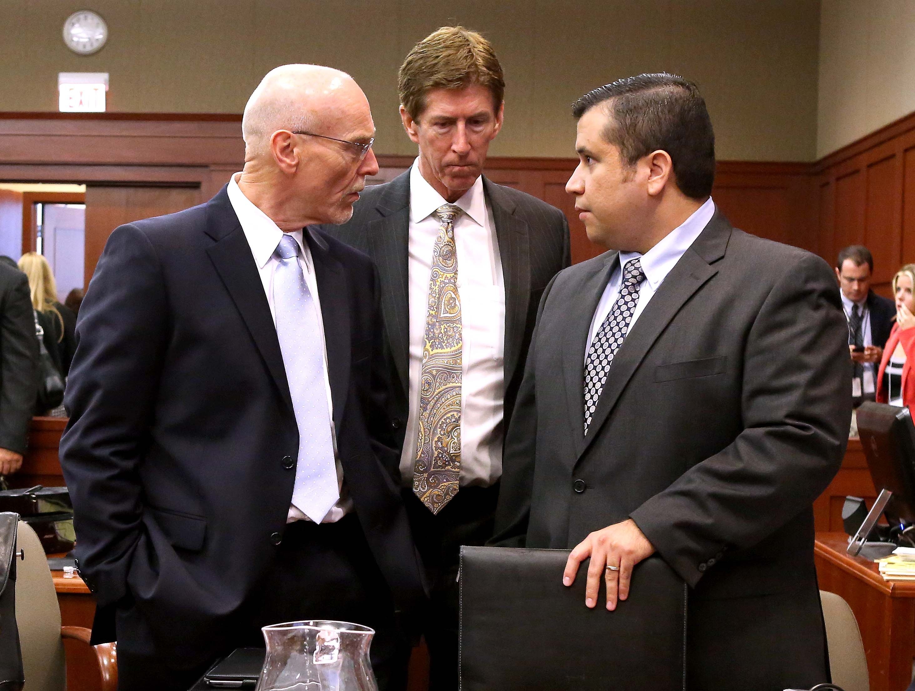 Co-counsel Don West (left) and Defence attorney Mark O'Mara (centre) talk with George Zimmerman during opening arguments in Seminole circuit court in Sanford in Florida. Photo: Reuters.