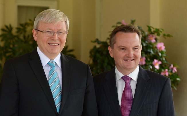 Australia's new Treasurer Chris Bowen (right) stands alongside new Australian Prime Minister Kevin Rudd (left) following a swearing in at Government House in Canberra. Photo: AFP