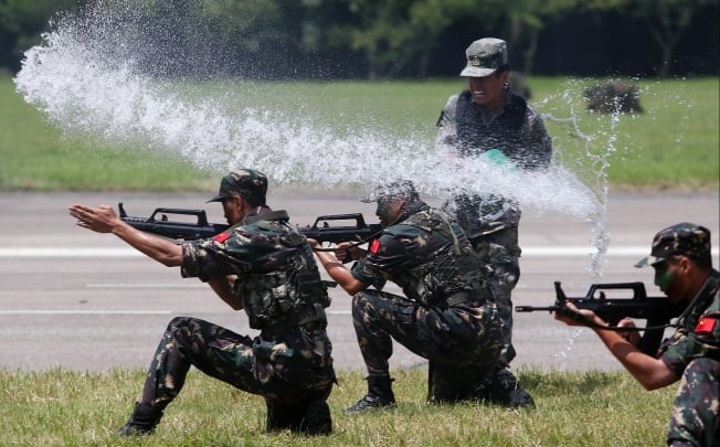 PLA soldiers perform drills at their Shek Kong barracks. Photo: Sam Tsang