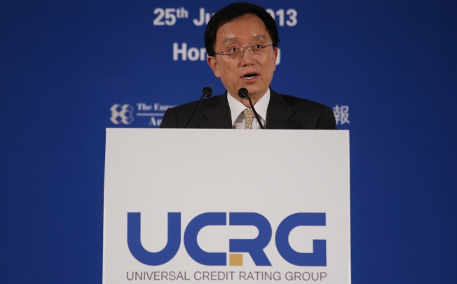 Guan Jianzhong, chairman of the Universal Credit Rating Group, delivers his speech at the launch ceremony. Photo: AP