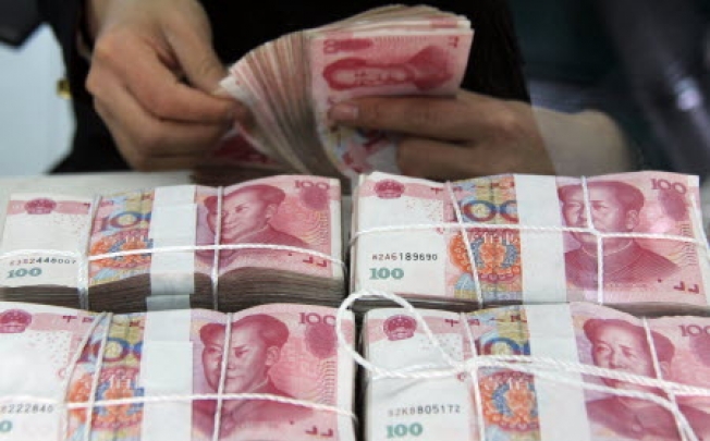 Few commentators bother to ask about the practicalities of hot money creeping into China for profits. Photo: Xinhua