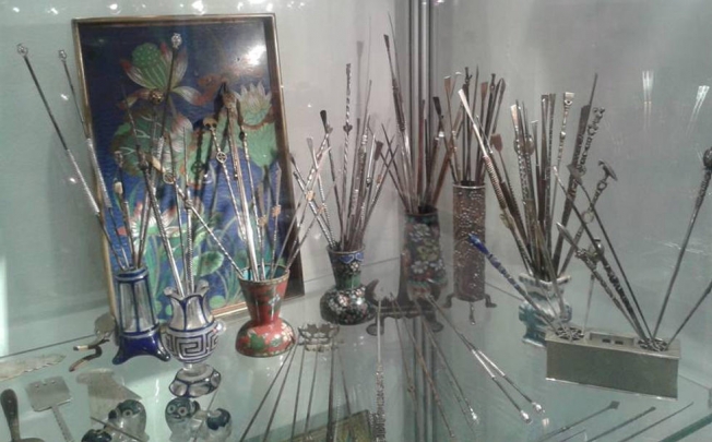 Pipe dreams: ornate opium pipes on display at Maggs, in Mayfair, London.