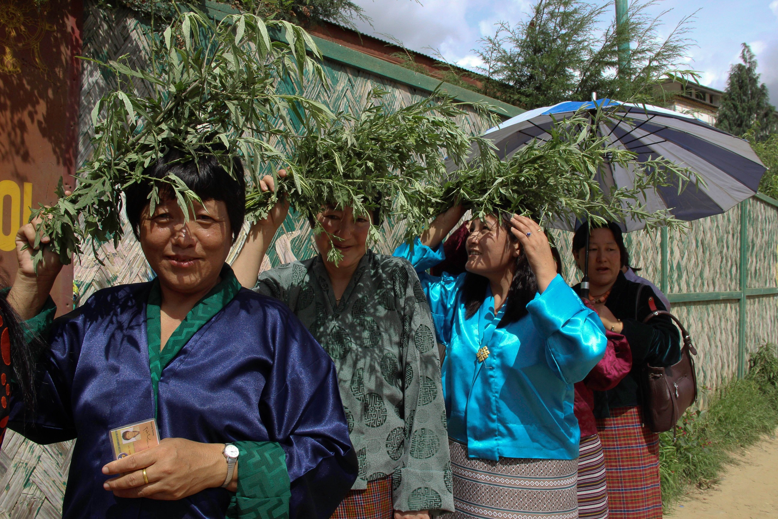 Bhutanese women wait in line to cast their votes at the Changbangdru polling station in Thimphu on Saturday. Photo: AP