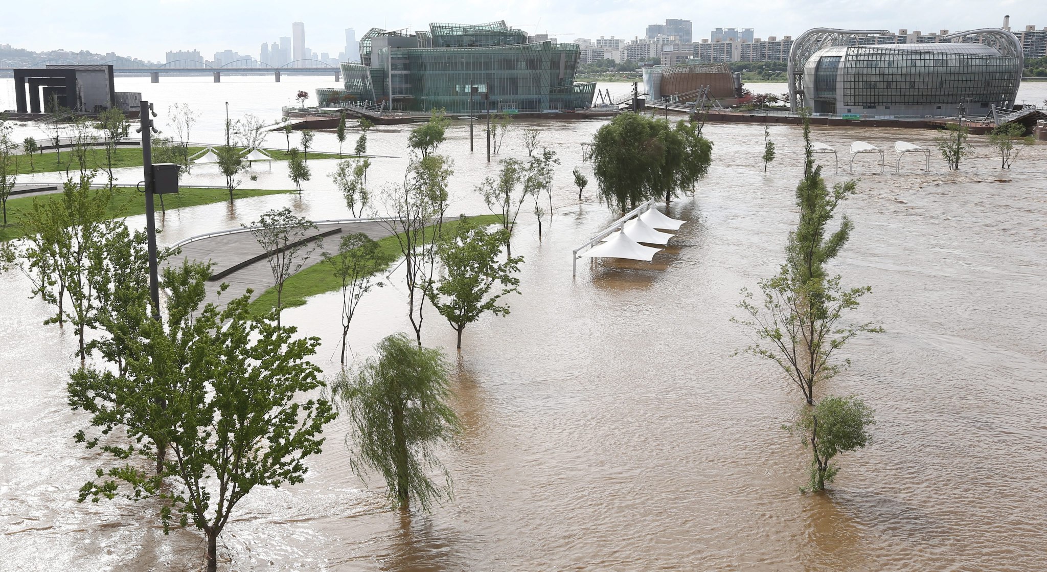 A public park alongside the Han River in central Seoul, South Korea, is under flood water on Monday. Photo: EPA