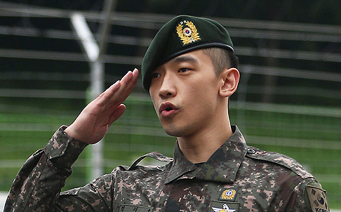 South Korean pop icon Rain gives a military salute after his discharge from mandatory military service outside the Defence Ministry in Seoul on July 10. Photo: AFP 