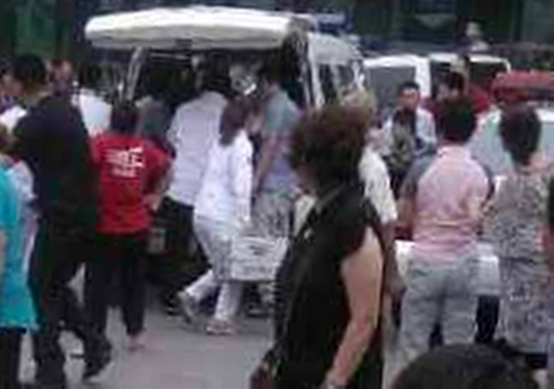 Ambulance staff tend the injured. Photo: SCMP 