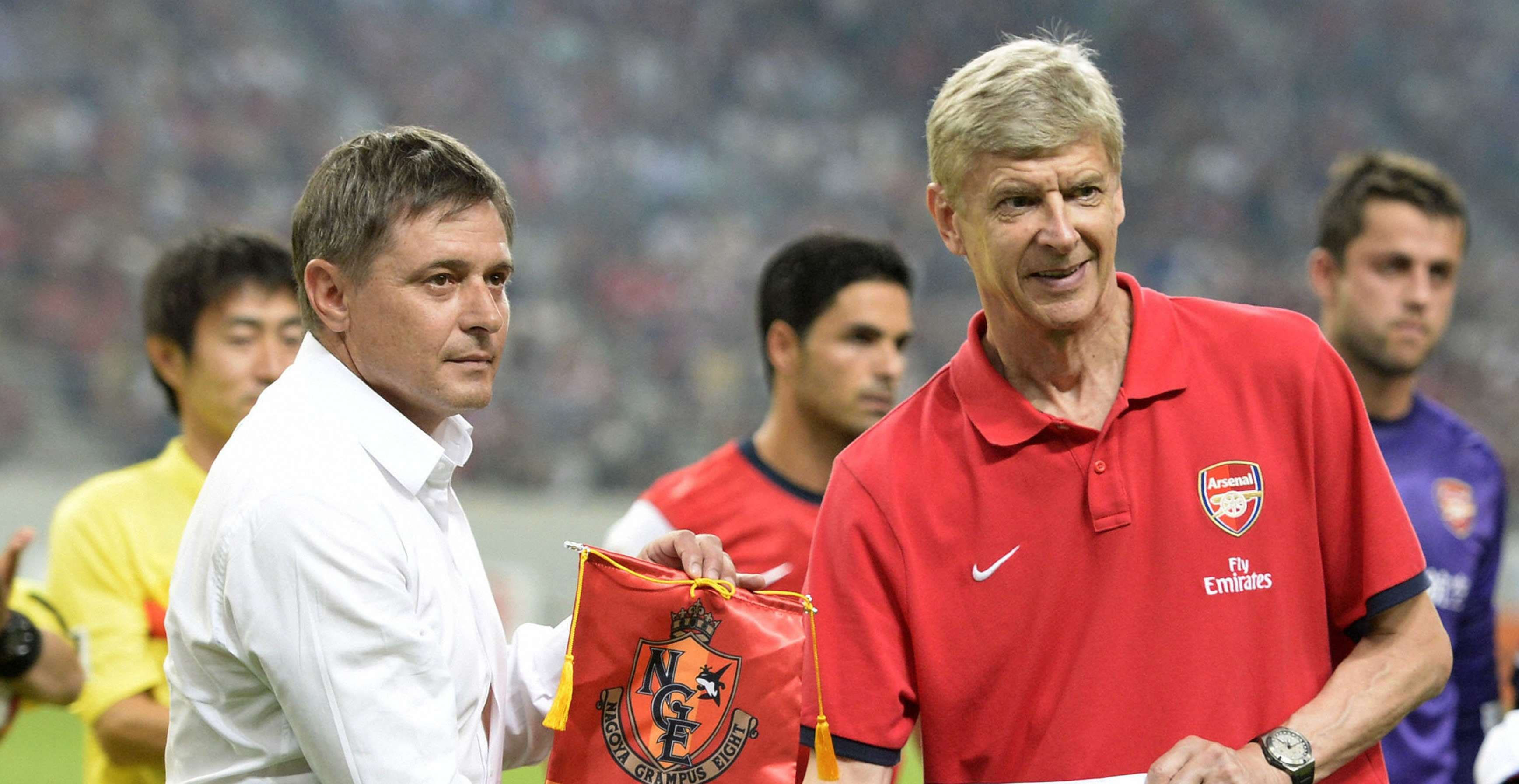 Arsenal's head coach Arsene Wenger (right) shakes hands with Nagoya Grampus manager Dragan Stojkovic before their friendly soccer match as part of Arsenal's Asia Tour 2013 in Toyota, central Japan. Photo: Reuters