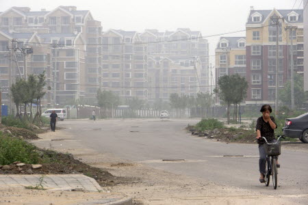 A residential site in Sunhe, known as the "central villa district" in Beijing, was sold at a record price this week. Photo: EPA 