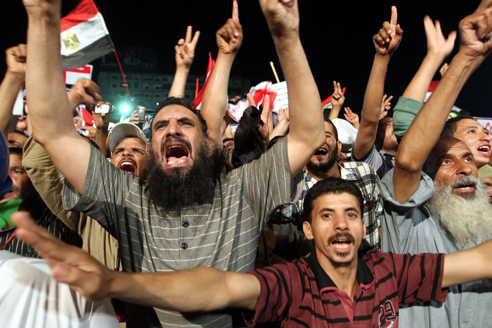 Supporters of the Muslim Brotherhood attend a protest in support of ousted President Mohamed Morsi outside the Rabaa al-Adawiya mosque in in Cairo, Egypt. Photo: EPA