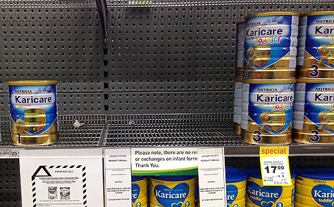 Shelves in a Wellington supermarket have been stripped clear because of suspected contamination of a Fonterra product. Photo: AFP