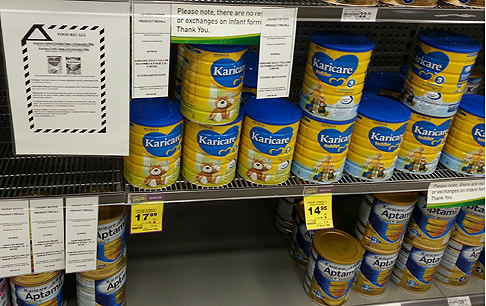 A recall notice for Karicare Gold+ Follow On Formula Stage 2 and other baby formula seen on a supermarket shelf in Wellington, New Zealand, last  Sunday. Photo: Xinhua