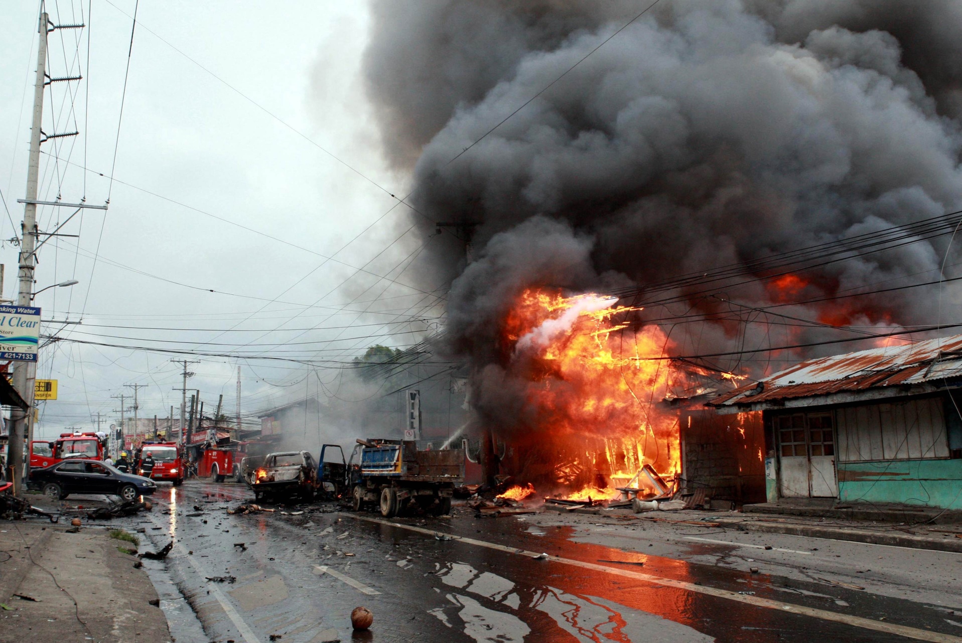 A building is seen on fire after a bomb explosion in Cotabato city, on the southern island of Mindanao on Monday. Photo: AFP