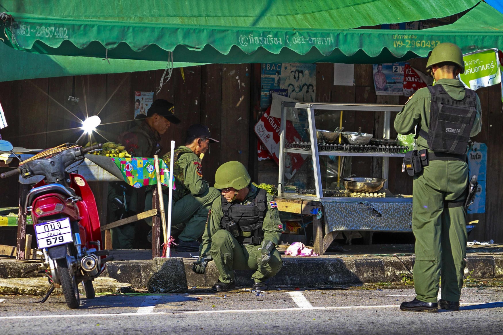 Thai security personnel inspect a site of a bomb attack at a roadside restaurant in Pattani province, south of Bangkok earlier this week. Photo: Reuters