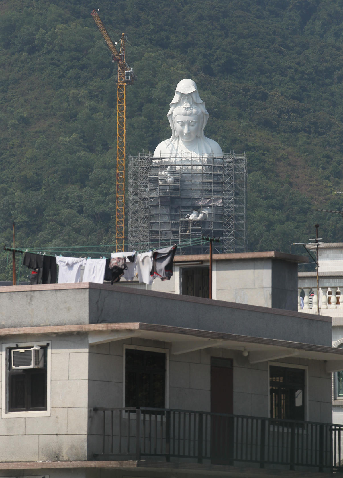 Construction work on a Goddess of Mercy statue. Photo: Nora Tam