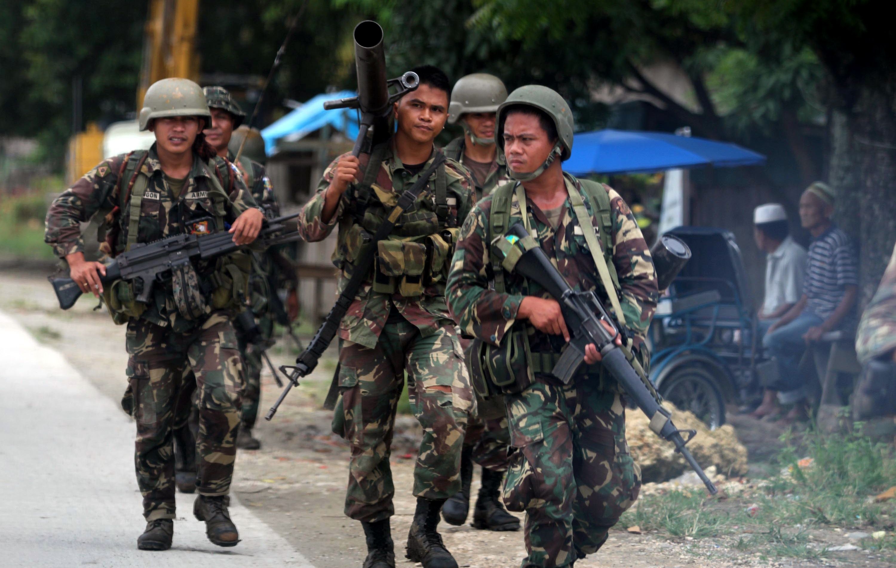 Philippines troops in action in the southern Philippines. The military launched an offensive on Saturday against breakaway Muslim rebels. Photo: AP 