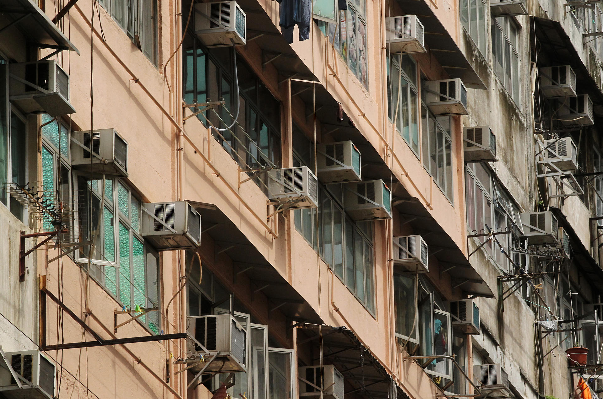 Air-conditioners provide needed comfort in Hong Kong's concrete jungle, but can drip on pedestrians below. Photo: K. Y. Cheng