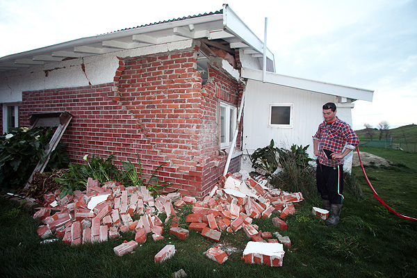 Kieran Hickman surveys the damage to his property at Taimate. Photo: AP