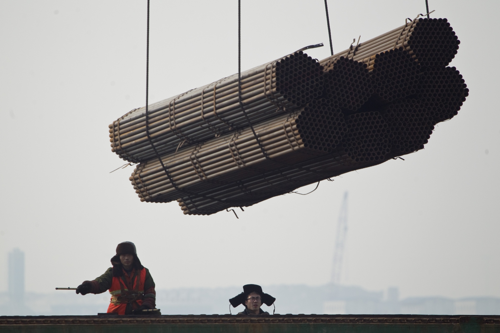 Steel pipes are loaded onto a ship at a port in Tangshan in Hebei. The EU asked the WTO to rule in a dispute over Chinese anti-dumping duties imposed on steel pipes imported from EU countries. Photo: AP 