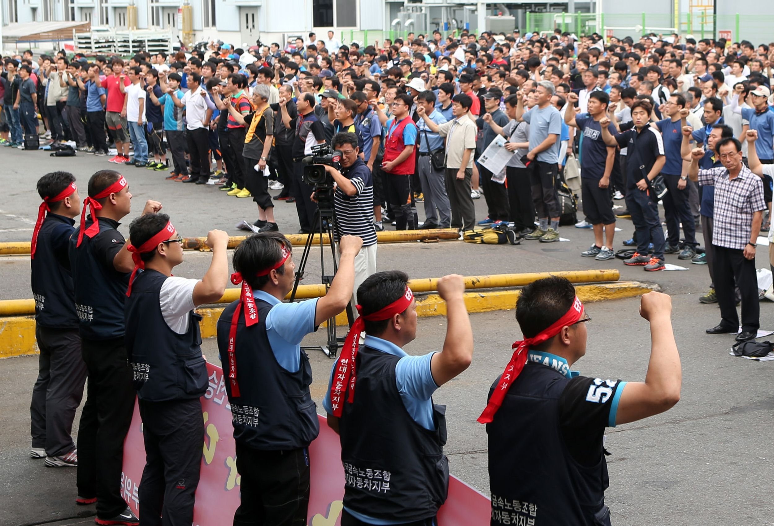 Workers from Hyundai Motor's labour union shout slogans during a partial strike at the company's main factory in Ulsan, southeast of Seoul, on Wednesday. Photo: AFP