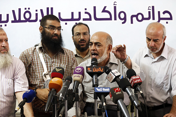 Muslim Brotherhood's Magdy Qorqor expresses outrage at Badie's arrest at a press conference in Cairo. Photo: Reuters