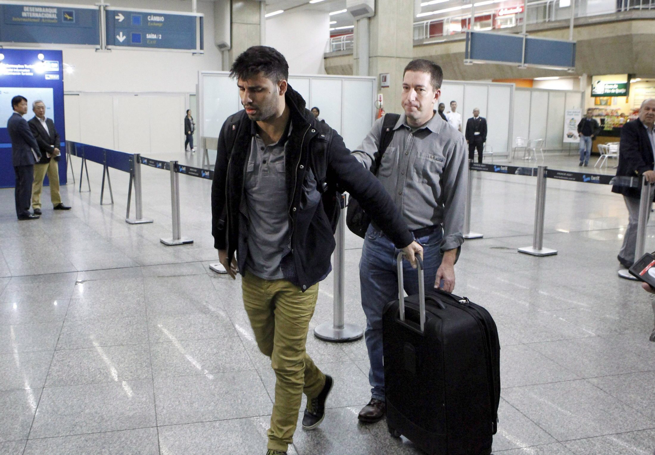 David Miranda and Glenn Greenwald arrive in Galeao Tom Jobim airport in Rio de Janeiro. Photo: EPA
