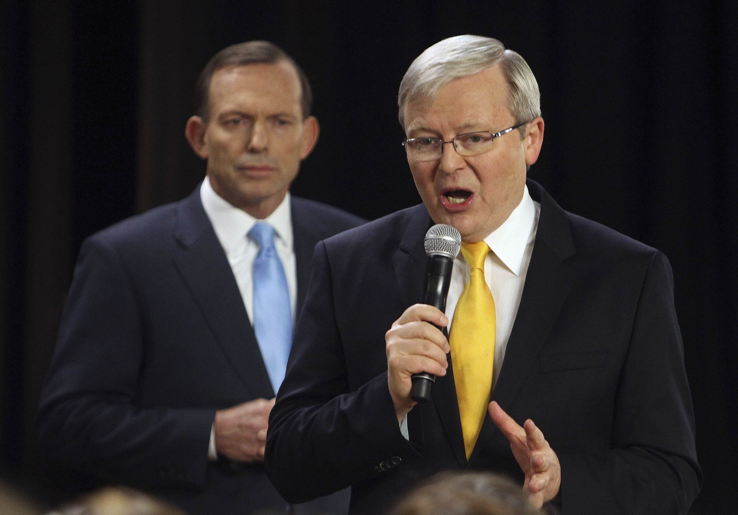Australian Prime Minister and leader of the Australian Labor Party Kevin Rudd (right) speaks as Liberal Party leader Tony Abbott listens on. Photo: Reuters