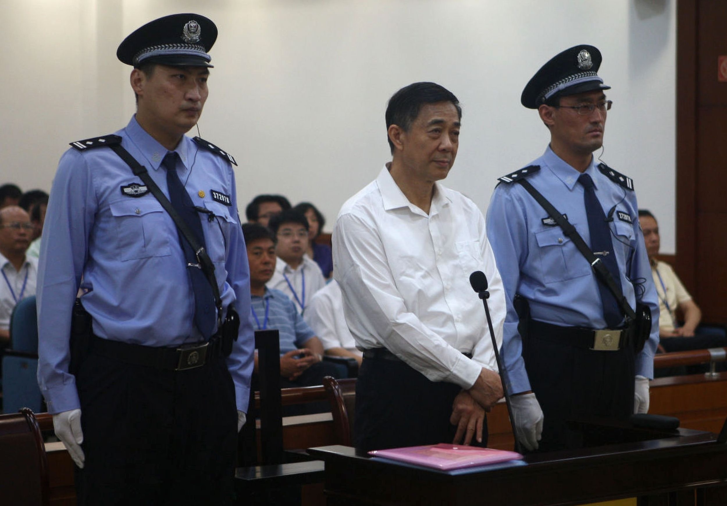 Former Chinese political star Bo Xilai (centre) standing on trial in the Intermediate People's Court in Jinan in Shandong province. Photo: AFP