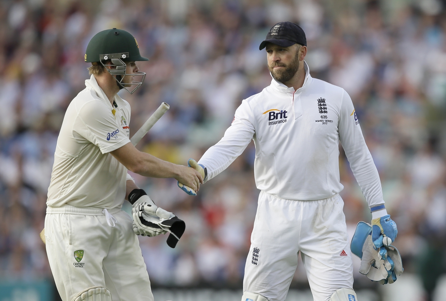 England's wicketkeeper Matt Prior, right, shakes hands with Australia's Steven Smith as Australia declare their first innings on 492 for 9, with Smith unbeaten on 138, during play on the second day of the fifth Ashes cricket Test at the Oval cricket ground in London. Photo: AP