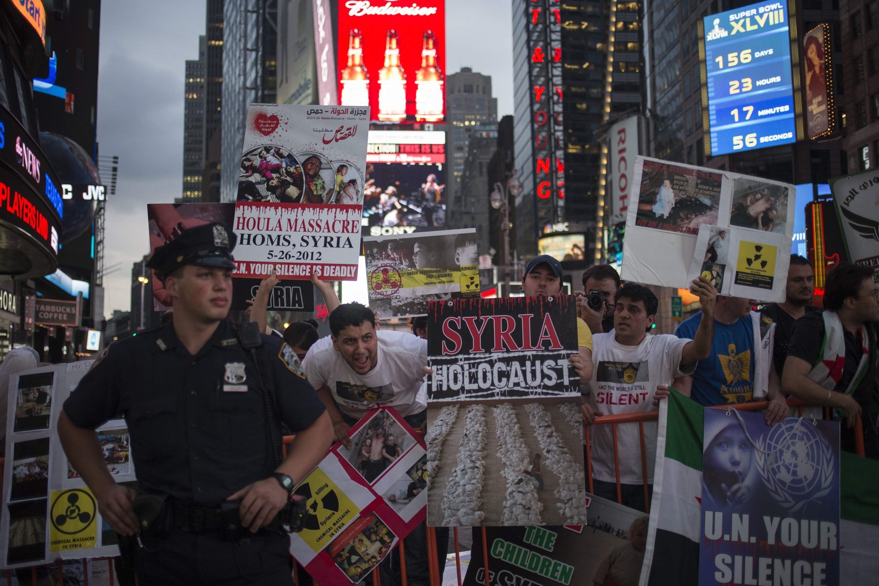 Syrian-Americans against Syrian President Bashar al-Assad's government shout slogans in an anti-war rally through Times Square, New York. Photo: Reuters