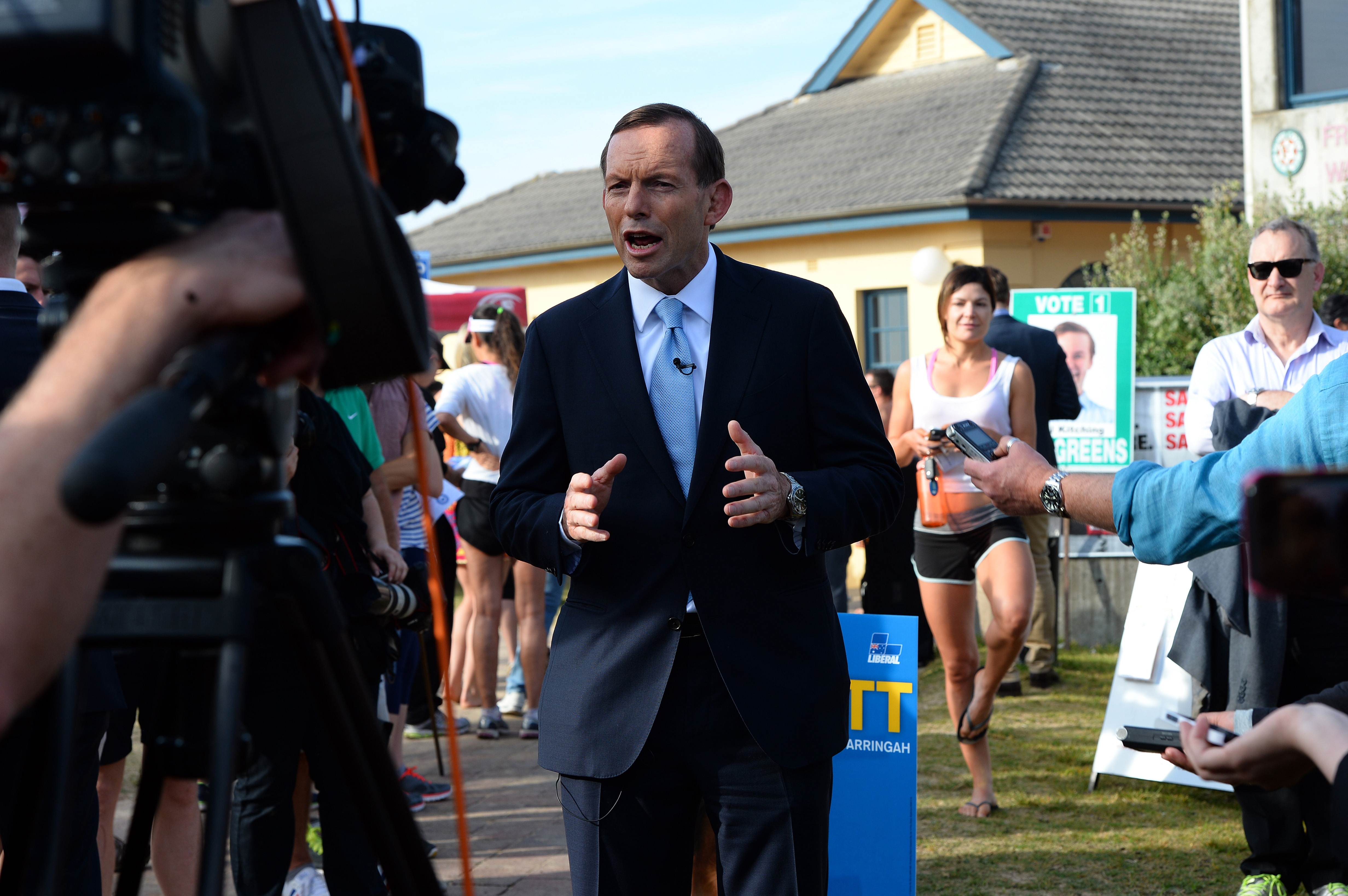  Australian opposition leader Tony Abbott speaks during a television interview after casting his vote in Sydney. Photo: AFP