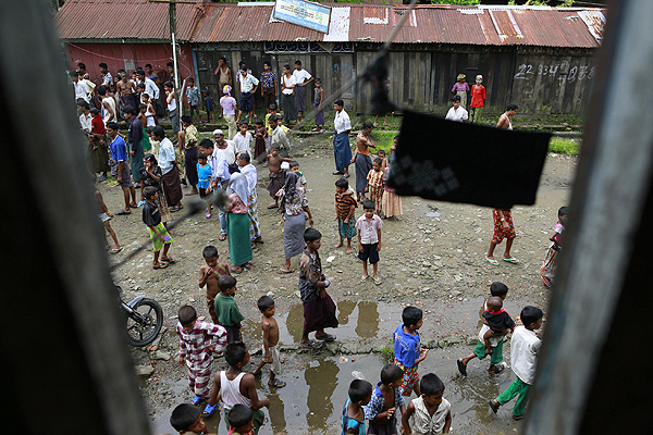 Rohingya Muslims gather on a street in Sittwe, Myanmar. Photo: Reuters